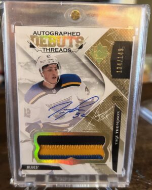 2017-18 Ultimate Collection Debut Threads RPA Tage Thompson Rookie Patch Auto with on-card autograph and multi-color patch.