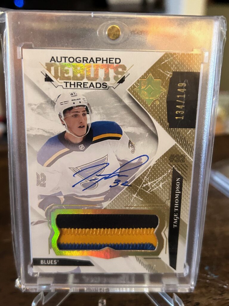 2017-18 Ultimate Collection Debut Threads RPA Tage Thompson Rookie Patch Auto with on-card autograph and multi-color patch.
