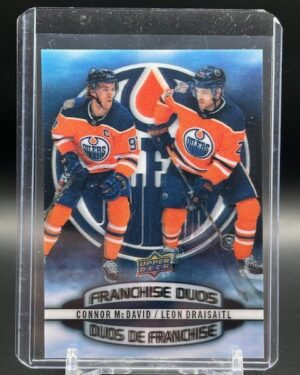 2019-20 Tim Hortons Franchise Duos 3D #D-7 hockey card featuring Connor McDavid and Leon Draisaitl in Edmonton Oilers uniforms with a dynamic 3D lenticular effect—highly collectible for NHL and Oilers fans.
