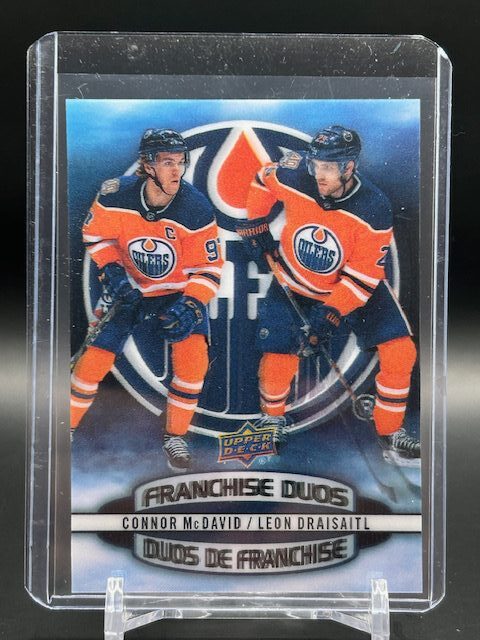 2019-20 Tim Hortons Franchise Duos 3D #D-7 hockey card featuring Connor McDavid and Leon Draisaitl in Edmonton Oilers uniforms with a dynamic 3D lenticular effect—highly collectible for NHL and Oilers fans.
