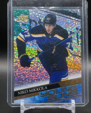 2020-21 Upper Deck Young Guns Speckled Rainbow Foil Niko Mikkola #470 rookie card, featuring a vibrant foil parallel finish, standout Young Guns rookie status, and St. Louis Blues defenseman in action from Series 2.