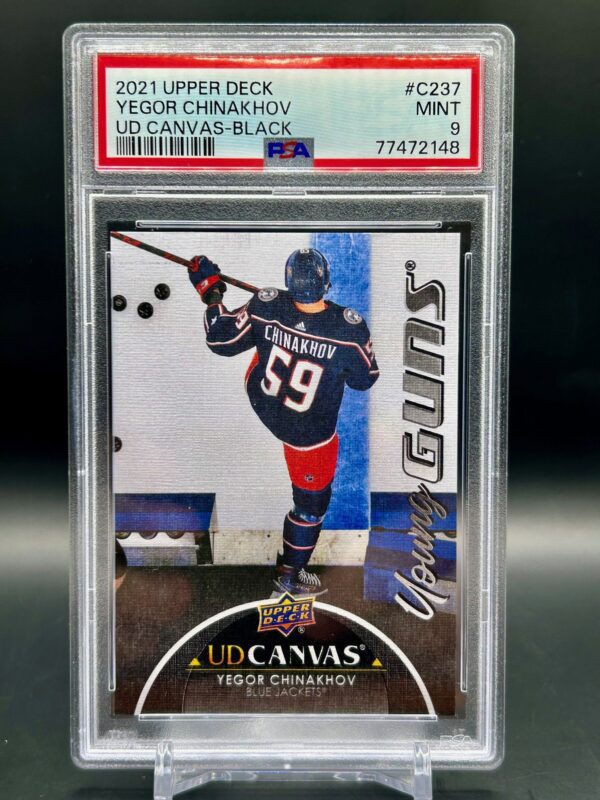 2021 Upper Deck Young Guns Canvas Black rookie card #C237 featuring Yegor Chinakhov of the Columbus Blue Jackets, graded PSA 9, a rare parallel highly sought after by NHL rookie card collectors.