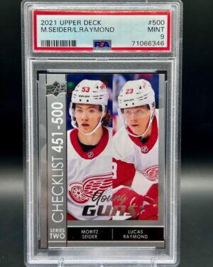 2021-22 Upper Deck Young Guns Checklist #500 rookie card featuring Moritz Seider and Lucas Raymond, PSA 9 graded, Detroit Red Wings, and iconic Young Guns design.