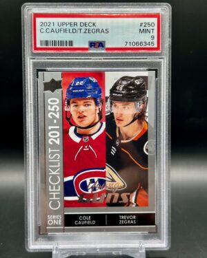 2021 Upper Deck Young Guns Cole Caufield Trevor Zegras #250 rookie card, graded PSA 9, featuring two NHL stars, iconic dual Young Guns rookie status, and crisp Upper Deck photography.