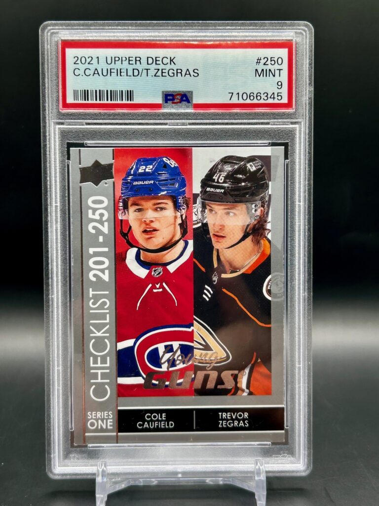 2021 Upper Deck Young Guns Cole Caufield Trevor Zegras #250 rookie card, graded PSA 9, featuring two NHL stars, iconic dual Young Guns rookie status, and crisp Upper Deck photography.