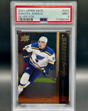 2021 Upper Deck Young Guns Silver Foil Dakota Joshua rookie card #204, graded PSA 9, featuring the St. Louis Blues forward in action with a metallic finish—highly collectible for NHL and Blues fans.