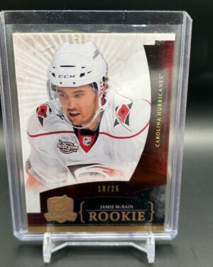 2010-11 Upper Deck The Cup Gold Spectrum Jamie McBain /25 #149 rookie card, featuring a rare gold spectrum parallel, serial numbered out of 25, and Carolina Hurricanes defenseman from Upper Deck’s high-end The Cup set.