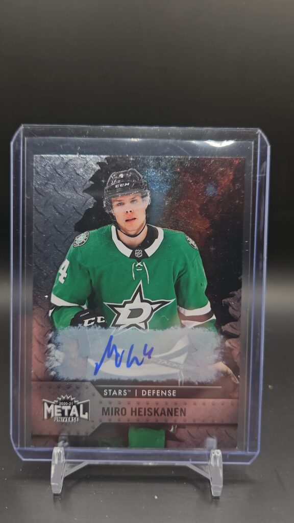 This image displays the 2020-21 Skybox Metal Universe Miro Heiskanen autograph card #69, a rare, hard-signed collectible for Dallas Stars and NHL fans.