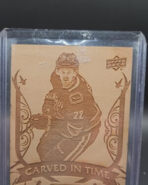 2019-20 Upper Deck Engrained Carved in Time card #CT-2 featuring Daniel Sedin of the Vancouver Canucks, a unique wood-textured collectible highly sought after by NHL and Canucks memorabilia collectors.