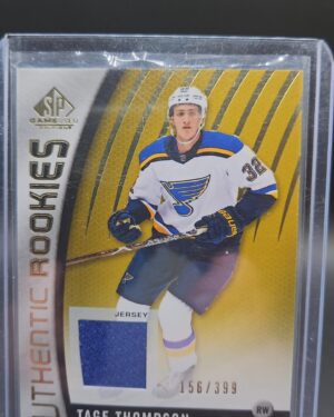 2017 SP Game Used Authentic Rookies Gold Jersey /399 Tage Thompson #97 rookie card featuring game-worn memorabilia and gold parallel, perfect for NHL collectors.