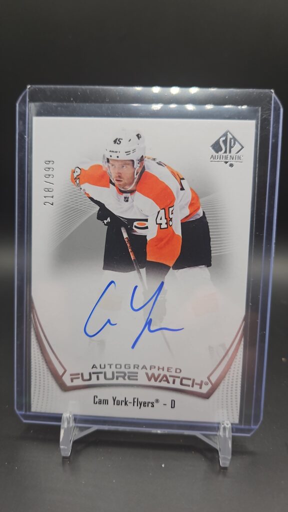 2021-22 SP Authentic Future Watch Rookie Autograph card #106 featuring Cam York of the Philadelphia Flyers, serial numbered to 999, a premium hard-signed rookie card highly sought after by NHL collectors.