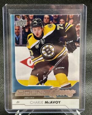 2017-18 Upper Deck Series 1 Young Guns Charlie McAvoy #242 rookie card featuring Boston Bruins defenseman, iconic Young Guns design, and strong collector appeal.