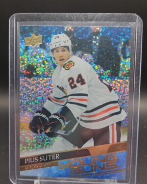 2020-21 Upper Deck Young Guns Speckled Rainbow Pius Suter #484 rookie card featuring Chicago Blackhawks forward, rare parallel, and vibrant finish.