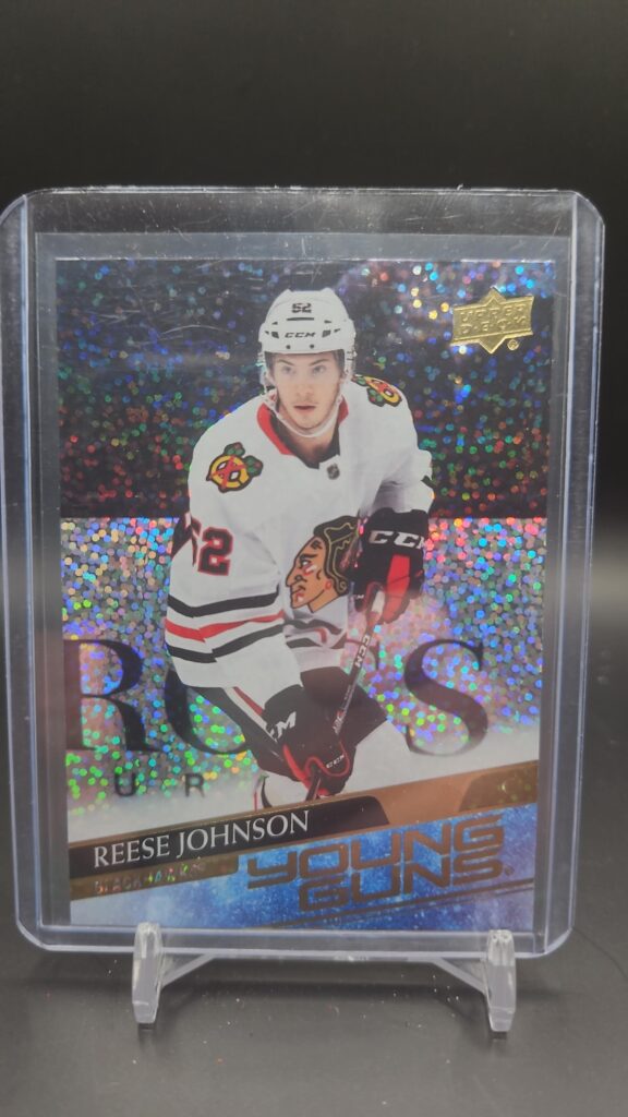 2020-21 Upper Deck Extended Series Young Guns Speckled Rainbow Foil Reese Johnson rookie card #725, Mint condition, Chicago Blackhawks, top collectible NHL rookie card.