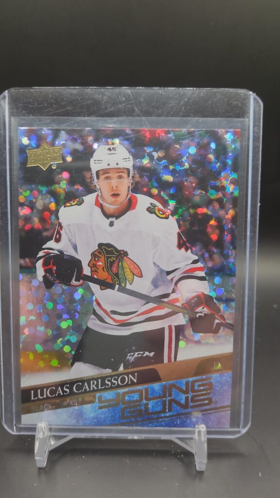 2020-21 Upper Deck Young Guns Speckled Rainbow Lucas Carlsson rookie card #212, Mint condition, Chicago Blackhawks, top collectible NHL rookie card.