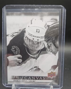 High-quality image showing the front of the 2022-23 Upper Deck Series 1 UD Canvas Black & White Charlie Coyle #C7 insert card featuring the Boston Bruins forward.