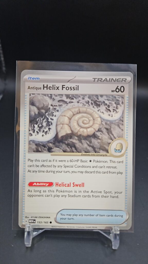 Standard non-holo Helix Fossil card from the Pokémon Scarlet and Violet 151 trading card game expansion set showing a silver border, Item Trainer layout, 60 HP, and unique fossil play mechanics.