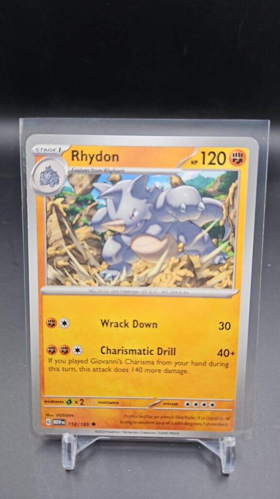 Front face of Rhydon 112/165 Uncommon card from the English Pokémon Scarlet & Violet 151 base set
