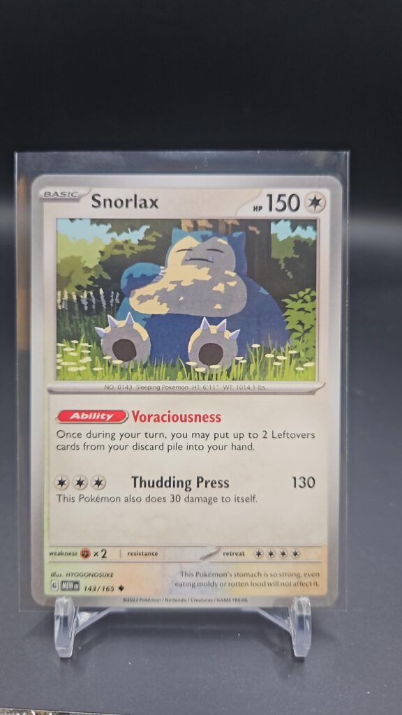 Front face of Snorlax 143/165 Rare card from the English Pokémon Scarlet & Violet 151 base set