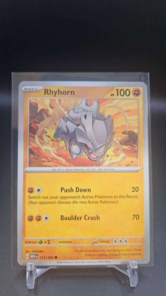Standard non-holo Rhyhorn card from the Pokémon Scarlet and Violet 151 trading card game expansion set showing a silver border, Fighting-type icon, 100 HP, Push Down attack, and Land Crush attack.