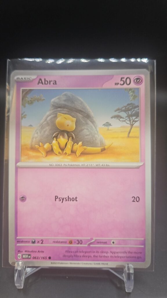 Standard non-holo Abra card from the Pokémon Scarlet and Violet 151 trading card game expansion set showing a silver border, Psychic-type icon, 50 HP, and Psyshock attack.