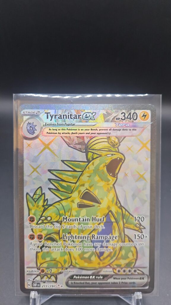 Pokémon TCG Tyranitar ex 211/197 Obsidian Flames Full Art Ultra Rare card displayed in near mint condition, showcasing detailed full-art illustration, powerful design, and holographic finish for collectors.