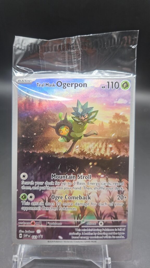 Sealed Pokémon TCG Teal Mask Ogerpon SVP123 Full Art Black Star Promo card displayed in original packaging, showcasing vibrant full-art illustration and exclusive promo status for collectors.