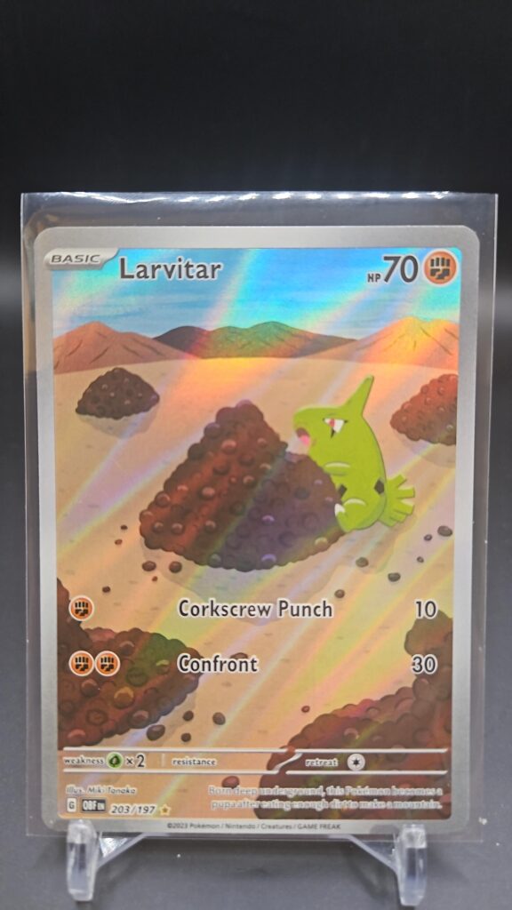 Pokémon TCG Larvitar 203/197 Obsidian Flames Illustration Rare Full Art card displayed in near mint condition, showcasing detailed full-art illustration and holographic finish for collectors.
