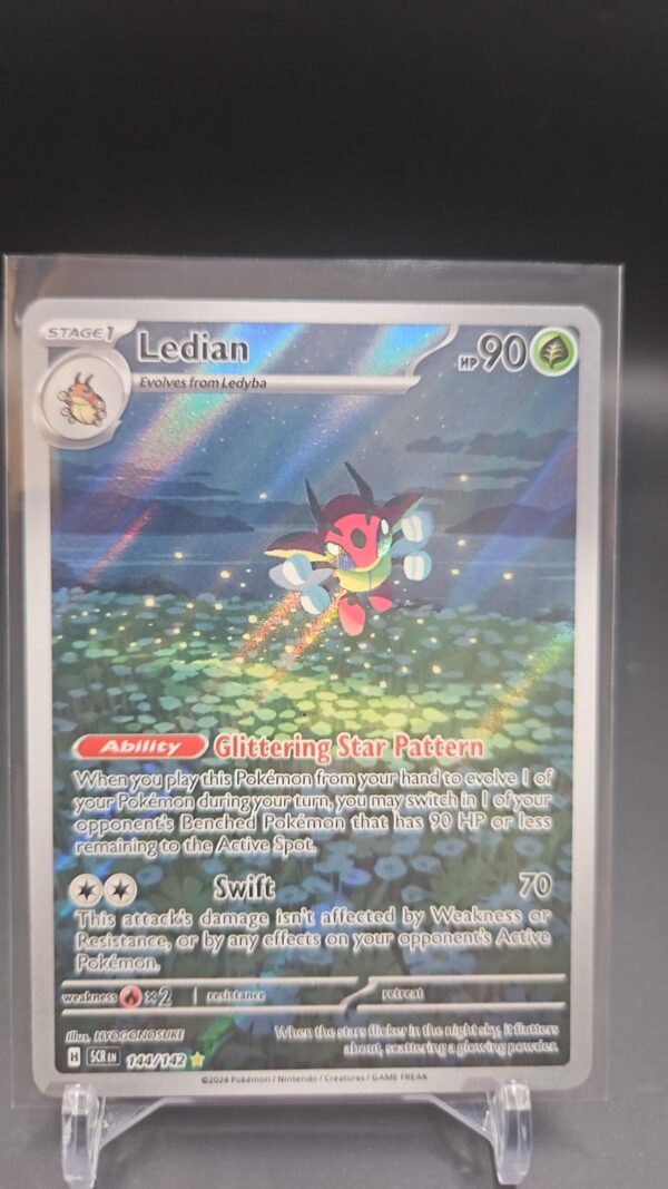 Pokémon TCG Ledian 144/142 Stellar Crown Illustration Rare Full Art Holo card displayed in near mint/mint condition, showcasing detailed full-art illustration and holographic finish for collectors