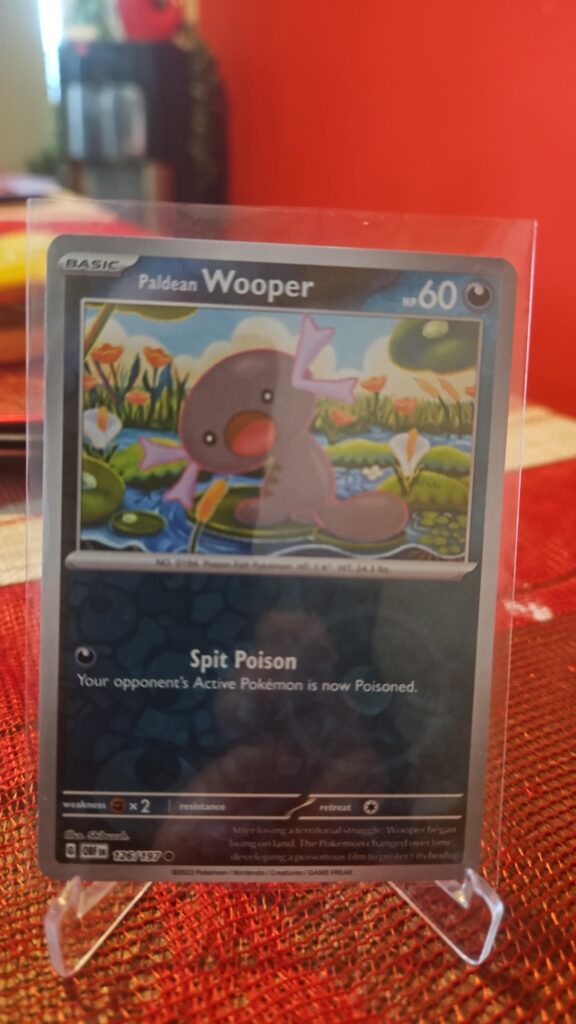 Paldean Wooper Reverse Holo Pokémon card from Pokémon TCG Obsidian Flames, illustrated by Kouki Saitou, shown in Near Mint condition with reflective parallel‑foil background.