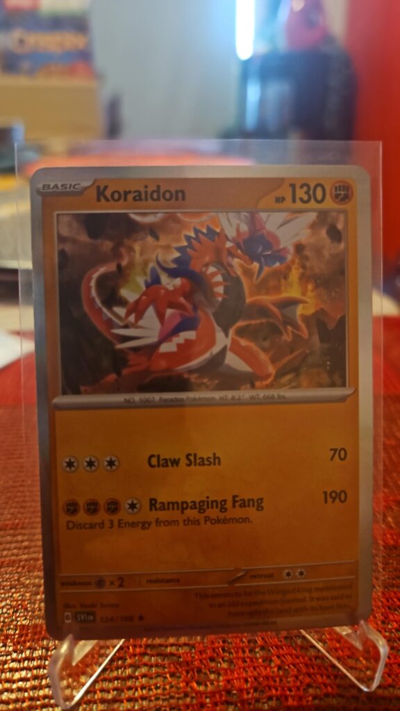 Koraidon 124/198 Holo Rare Pokémon card from the Scarlet & Violet Base Set displayed in NM/M condition with centered holo artwork.