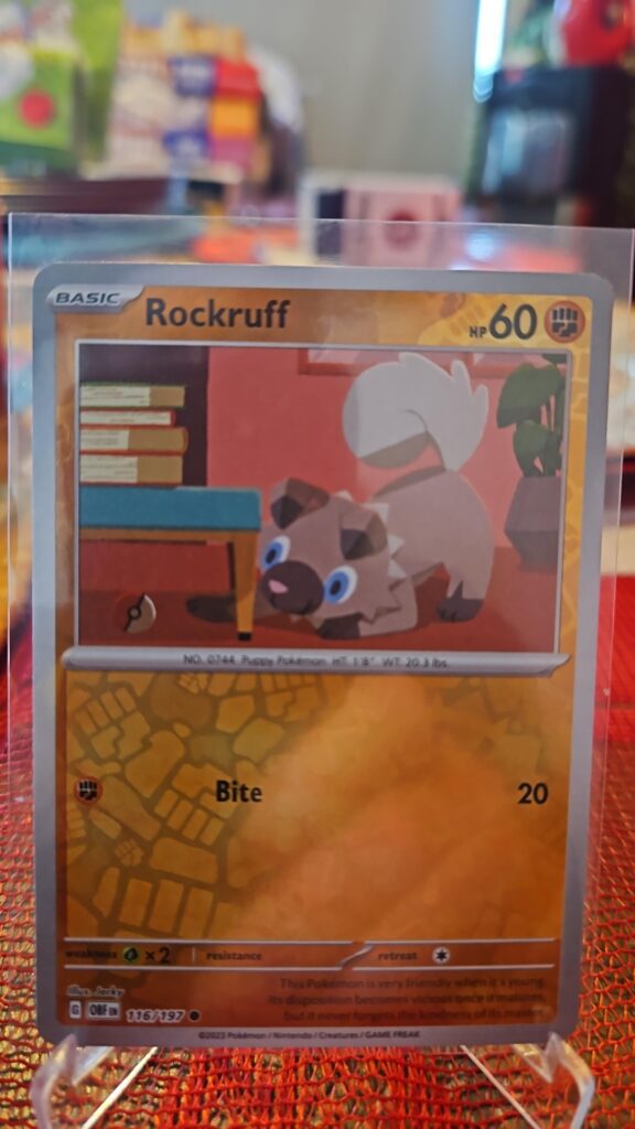 Rockruff Reverse Holo Pokémon card from Scarlet and Violet Obsidian Flames, Near Mint.