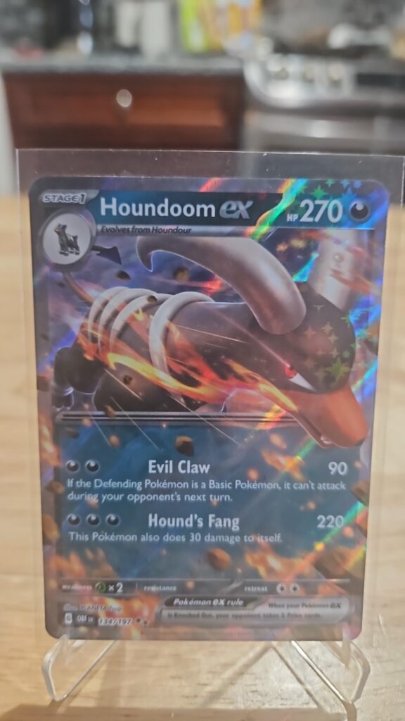 Pokémon TCG Houndoom EX 134/197 Obsidian Flames Ultra Rare Holo card displayed in near mint condition, showcasing detailed ultra rare design, dynamic illustration, and collectible finish for fans.
