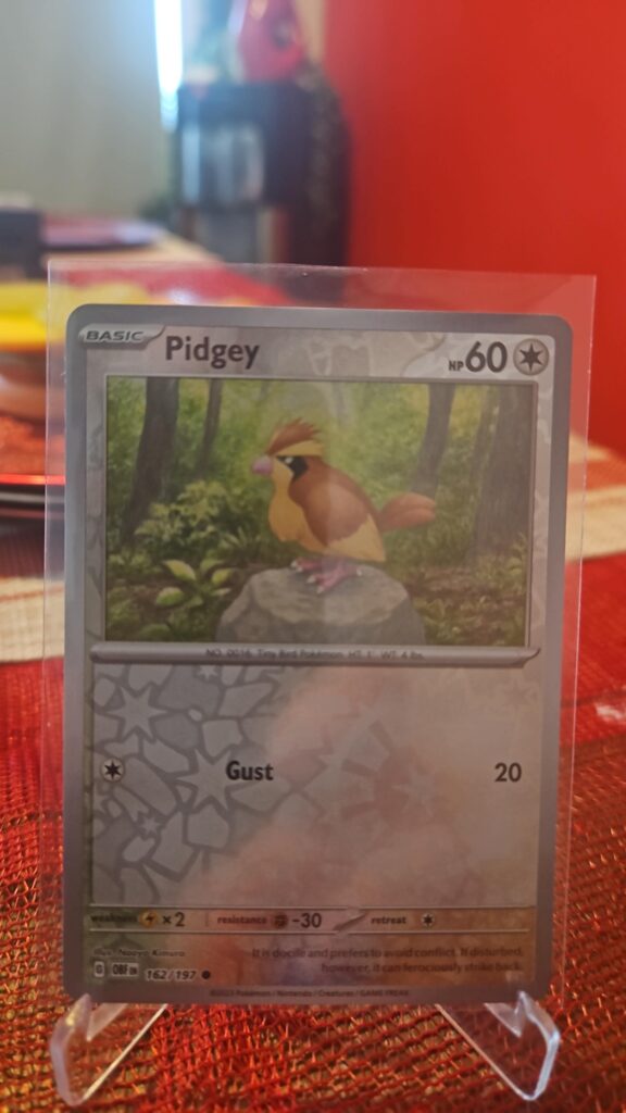 Pidgey Reverse Holo Pokémon card from Pokémon TCG Obsidian Flames, illustrated by Tika Matsuno, shown in Near Mint condition with reflective parallel‑foil background.