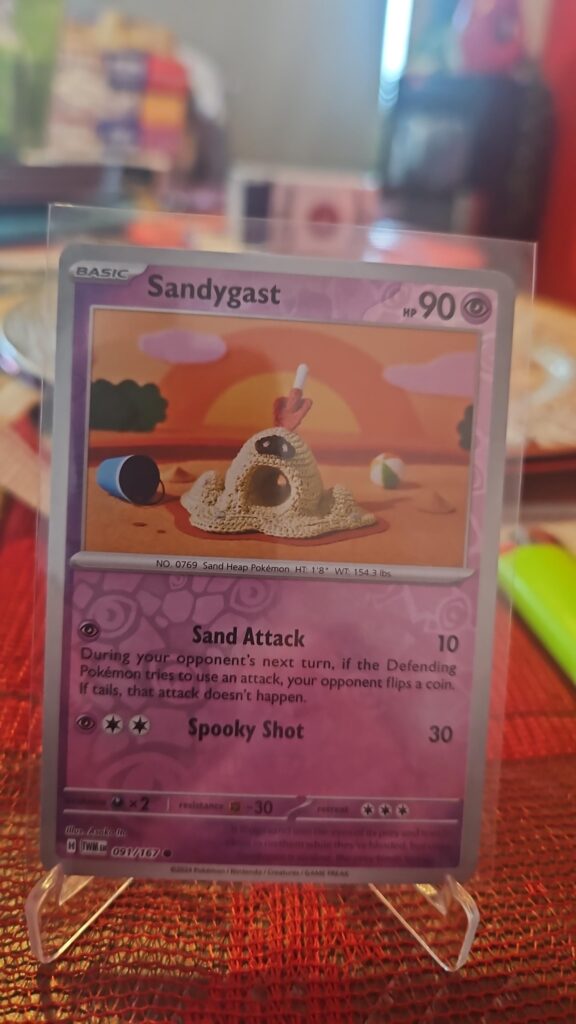 Sandygast 91/167 Reverse Holo Pokémon card from Scarlet and Violet Twilight Masquerade, illustrated by Shinji Kanda, Near Mint condition.