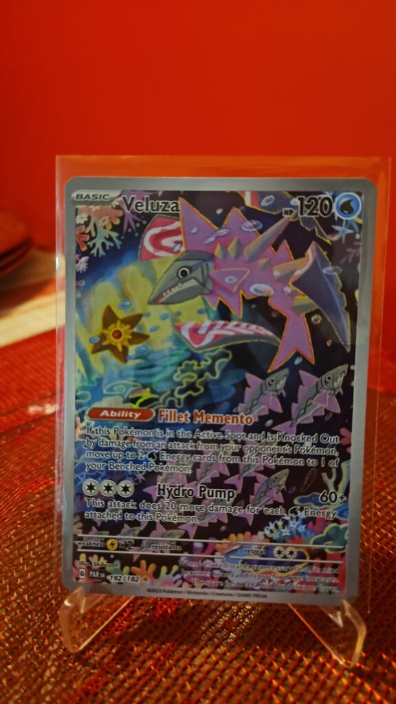 Pokémon TCG Veluza 192/182 Paradox Rift Holo Illustration Rare card displayed in near mint condition, showcasing detailed full-art illustration and holographic finish for collectors.