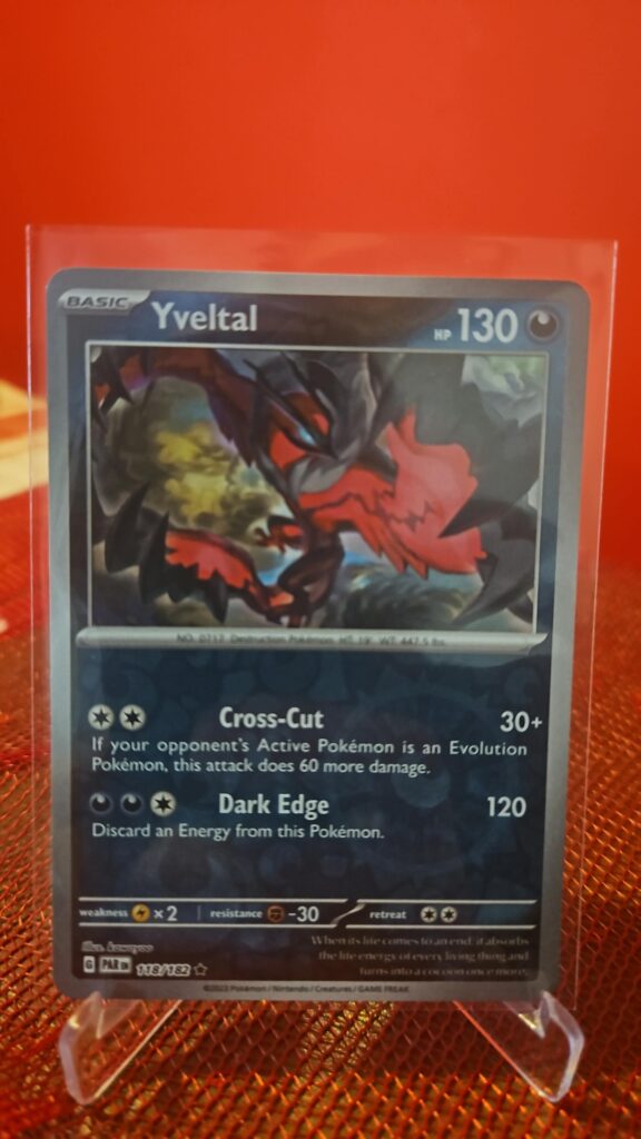 Yveltal Reverse Holo Rare Pokémon card from Pokémon TCG Paradox Rift, illustrated by Shinji Kanda, shown in Near Mint condition with reflective parallel‑foil background.