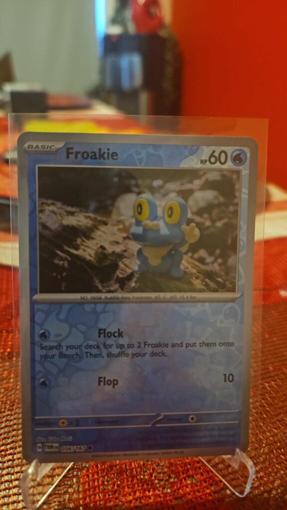 Reverse Holo Froakie 56/167 from Pokémon TCG Twilight Masquerade with silver border and reflective parallel foil.