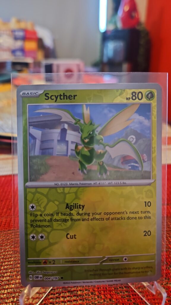Scyther Reverse Holo Pokémon card from Scarlet and Violet Obsidian Flames, Near Mint.