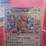 Pokémon TCG Hydreigon ex 119/191 Surging Sparks Double Rare card displayed in near mint condition, showcasing detailed double rare design and holographic finish for collectors.