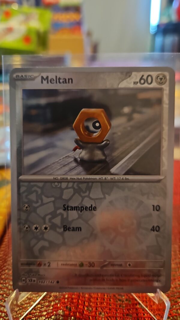 Meltan 102/142 Reverse Holo Pokemon TCG: Stellar Crown Near Mint