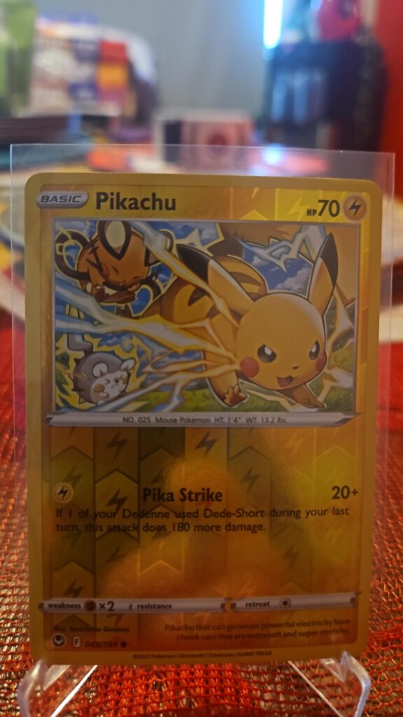 Pikachu 49/195 Reverse Holo Pokémon card from Pokémon TCG Silver Tempest, illustrated by Souichirou Gunjima, shown in Near Mint condition with reflective parallel‑foil background.