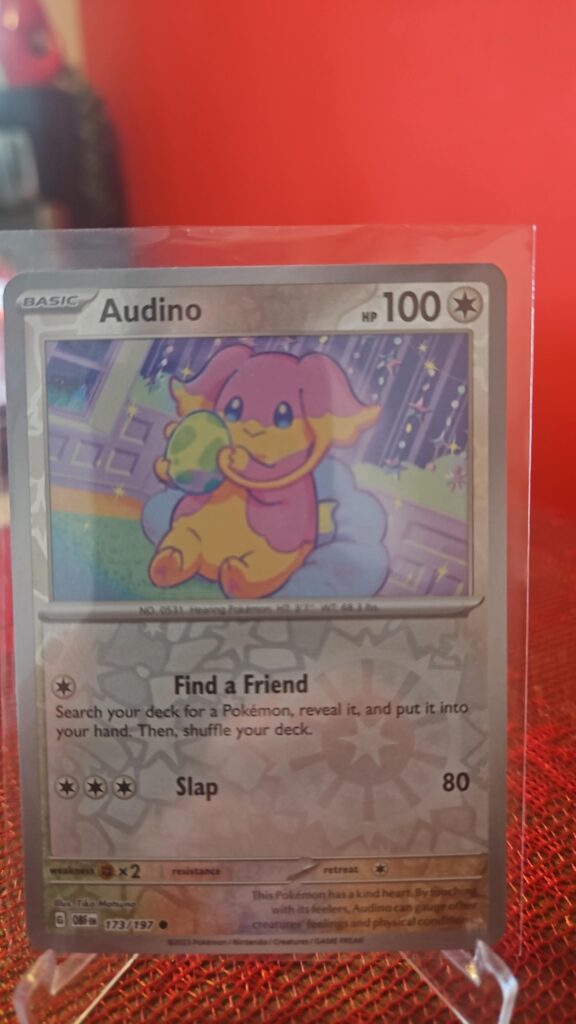 Audino Reverse Holo Pokémon card from Pokémon TCG Obsidian Flames, illustrated by Tika Matsuno, shown in Near Mint condition with reflective parallel‑foil background.