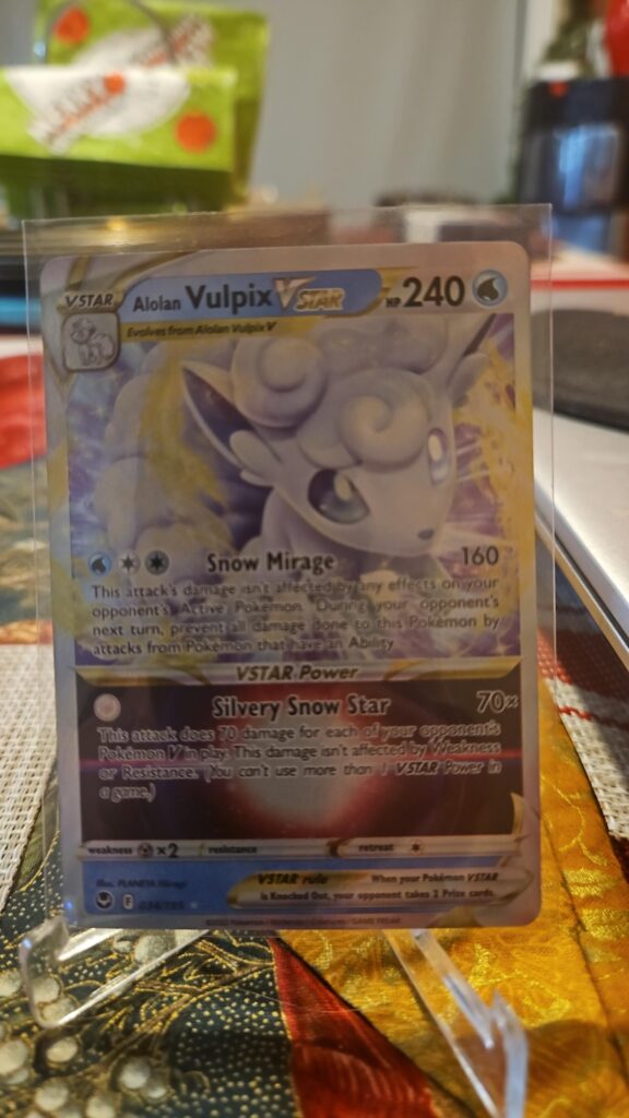 Pokémon TCG Alolan Vulpix VSTAR 34/195 Silver Tempest Ultra Rare card displayed in near mint condition, showcasing magical VSTAR illustration, exclusive ultra rare design, and collectible finish for fans.