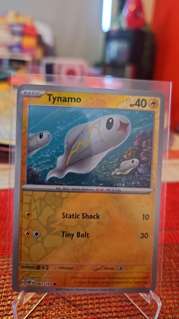 Tynamo Reverse Holo Pokémon card from Scarlet and Violet Obsidian Flames, Near Mint.
