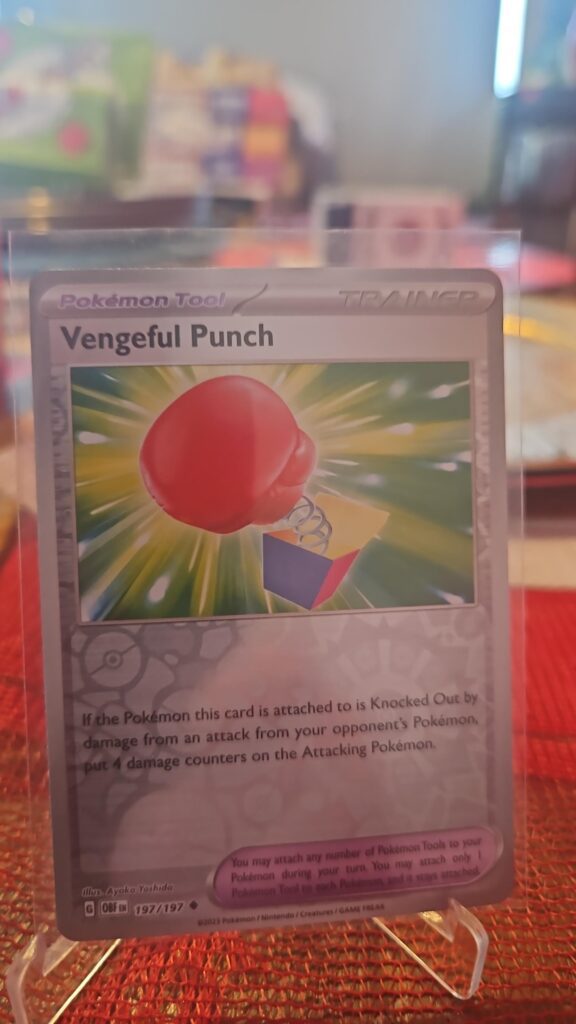 Vengeful Punch Reverse Holo Pokémon card from Scarlet and Violet Obsidian Flames, Near Mint.