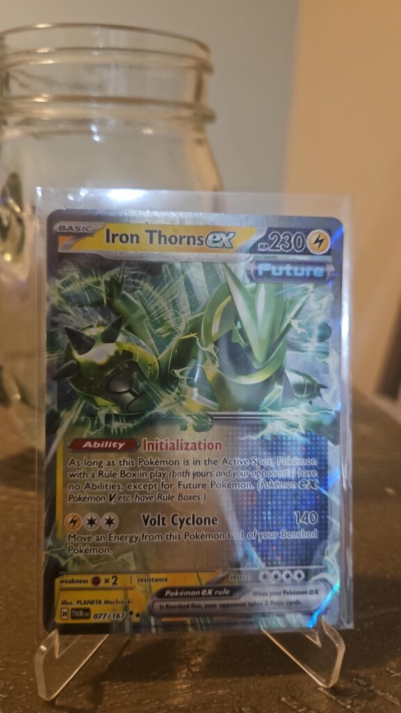 Iron Thorns ex 77/167 Double Rare card from Twilight Masquerade, featuring dynamic artwork and vibrant holo finish.