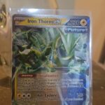 Iron Thorns ex 77/167 Double Rare card from Twilight Masquerade, featuring dynamic artwork and vibrant holo finish.