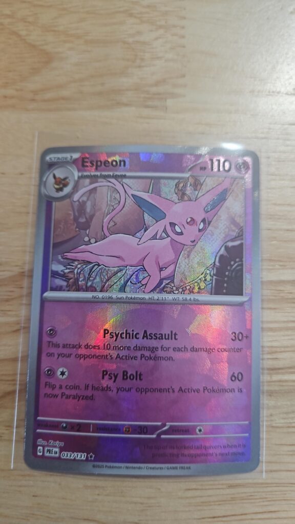 Pokémon TCG Espeon Poké Ball 033/131 Prismatic Evolutions card displayed in near mint condition, showcasing detailed Poké Ball-themed illustration for collectors.