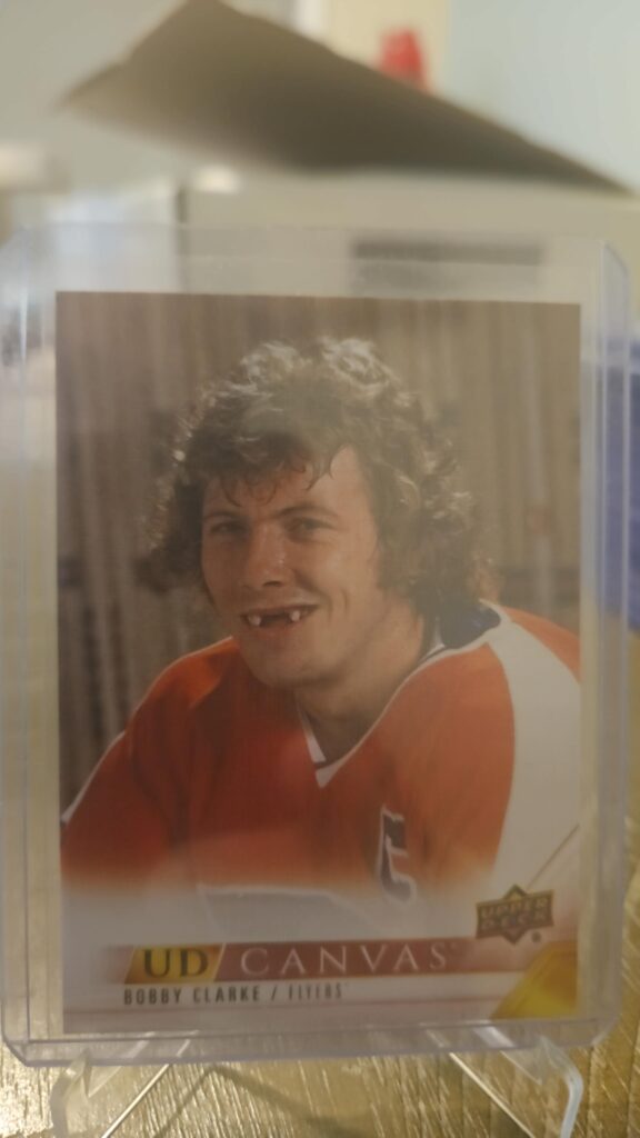 Bobby Clarke 2022-23 Upper Deck Series 2 Canvas Retired Stars #C245 card, a prized collectible for Philadelphia Flyers fans.